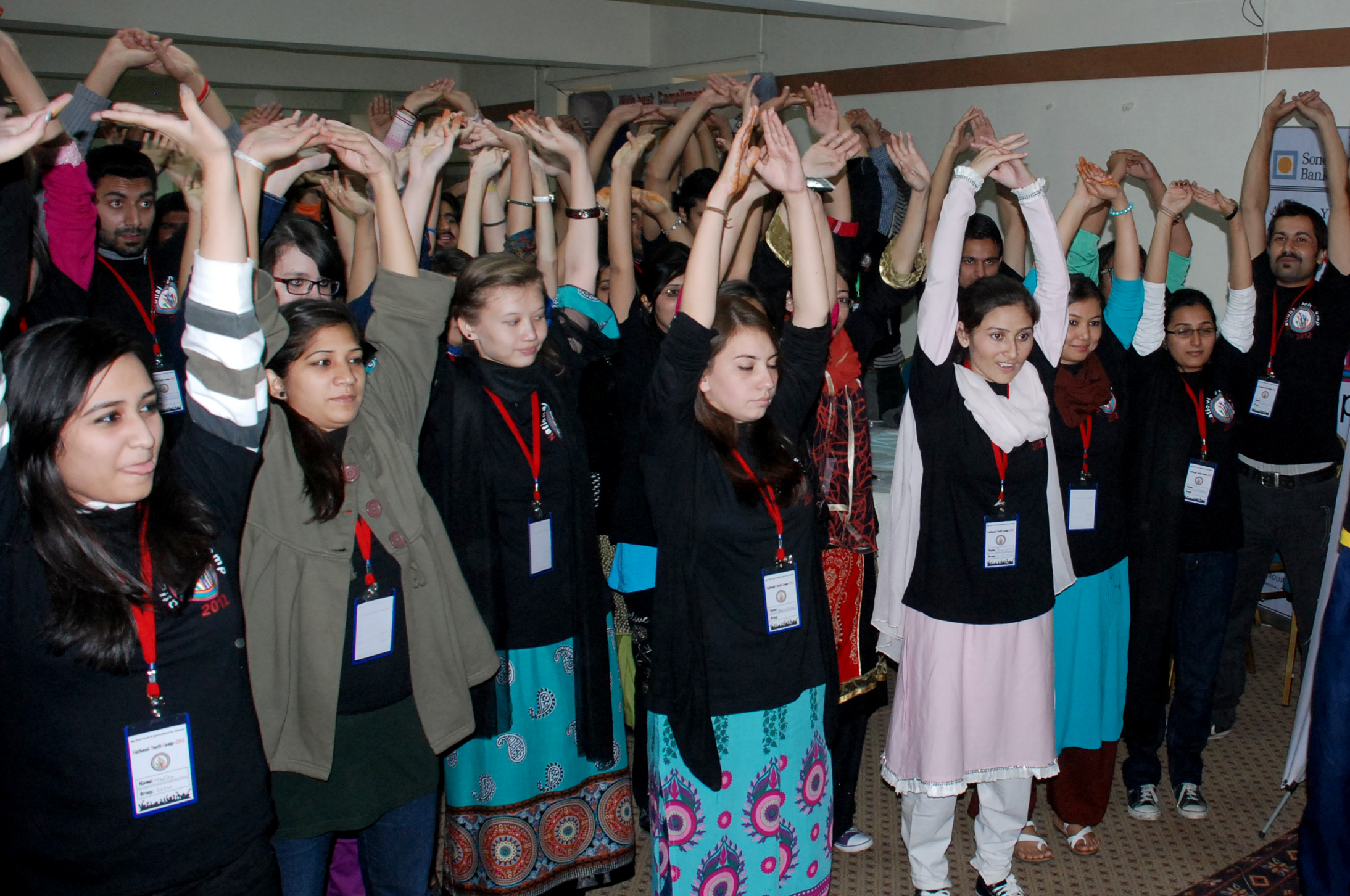 Participants stretch during an exercise session at the national youth camp organised by Aga Khan Youth and Sports Board for Pakistan. Photo: The Ismaili Pakistan / Al Jalil