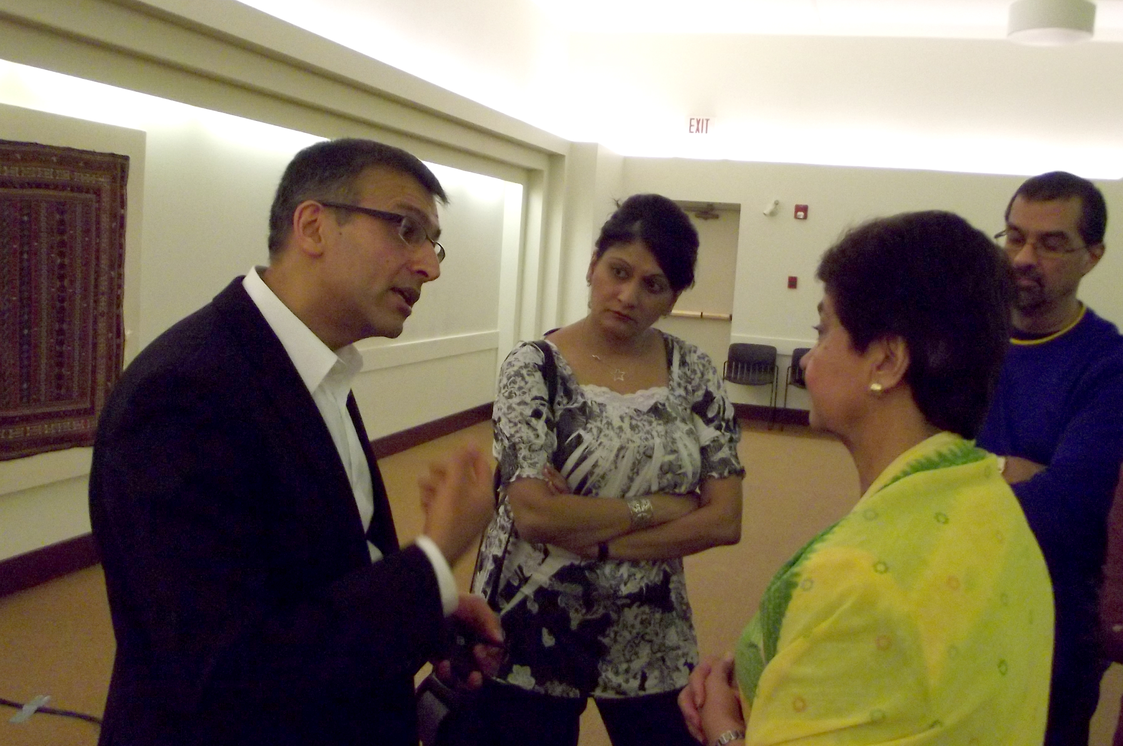 Dr Alykhan Nanji speaks to members of the audience after delivering a presentation to the Jamat about the risk of NCDs. Photo: Shirzad Chunara