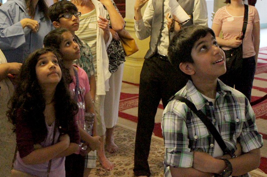 Young Ismailis admire the architecture of the Masjid Sultan, which features Mughal, Arab and European influences. Photo: Akbar Humayun Makani