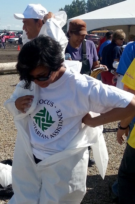 A FOCUS volunteer prepares to remove flood debris from homes in High River. Photo: Moshin Ukani