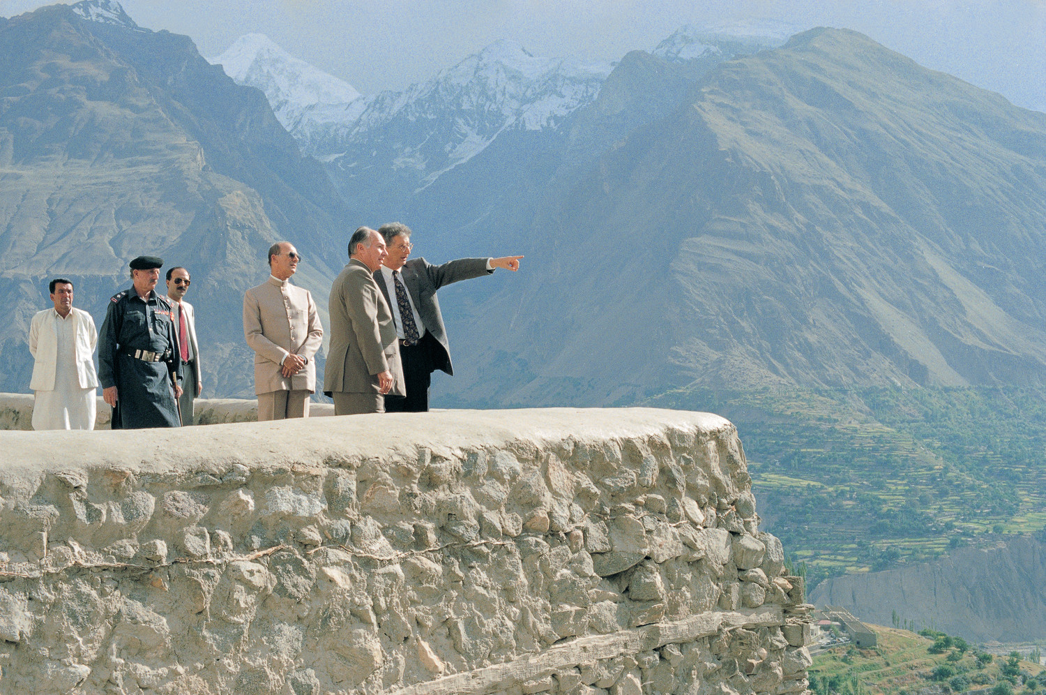 Mawlana Hazar Imam and Prince Amyn take in a view of the mountainous Hunza valley from the vantage point of the 700-year-old Baltit Fort, whose restoration by the Historic Cities Programme of the Aga Khan Trust for Culture began in 1992. Photo: AKDN / Gary Otte