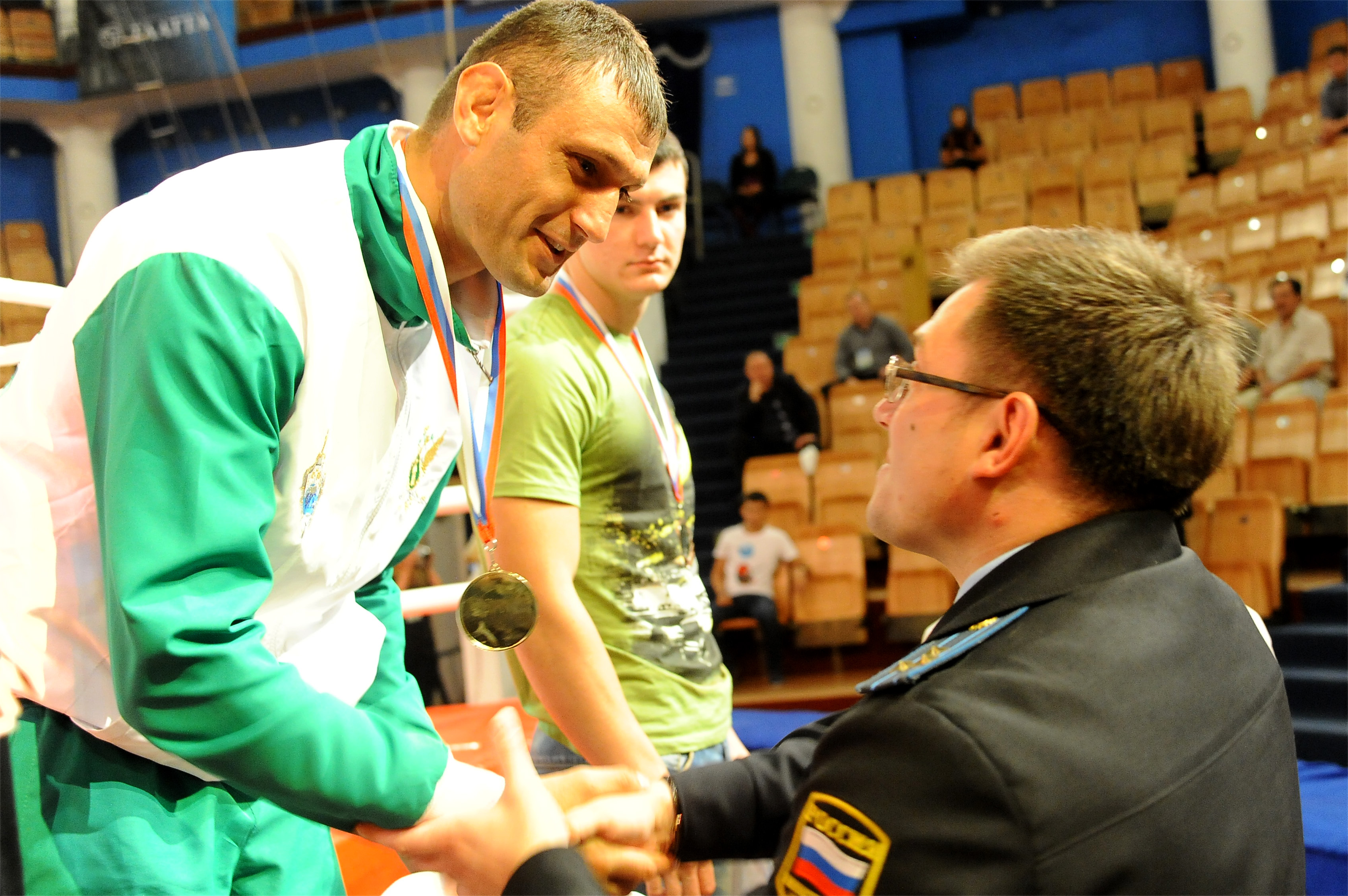 Arthur Odilbekov receives a gold medal. The Tajik Ismaili athlete has competed and won many championships in Russia and internationally, and is working to further promote sport in his home country. Photo: Courtesy of Arthur Odilbekov