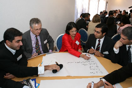 Delegates participate in a conference workshop. Photo: Arlindo Alves Homem.     